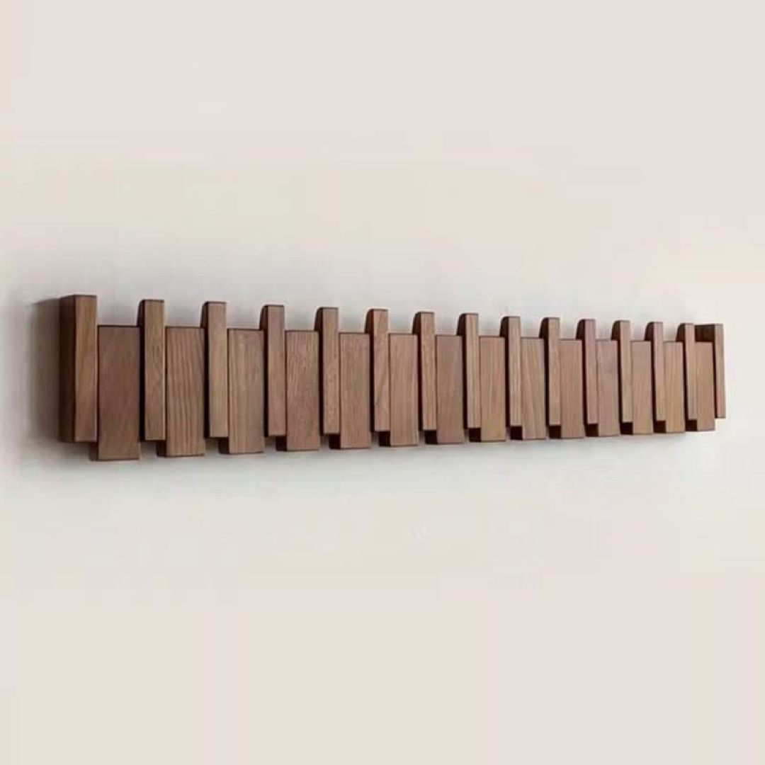 Piano-Inspired Coat Rack with Folding Hooks