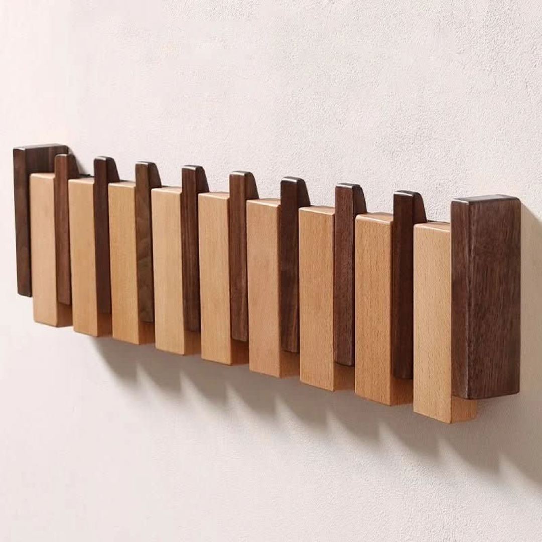 Piano-Inspired Coat Rack with Folding Hooks